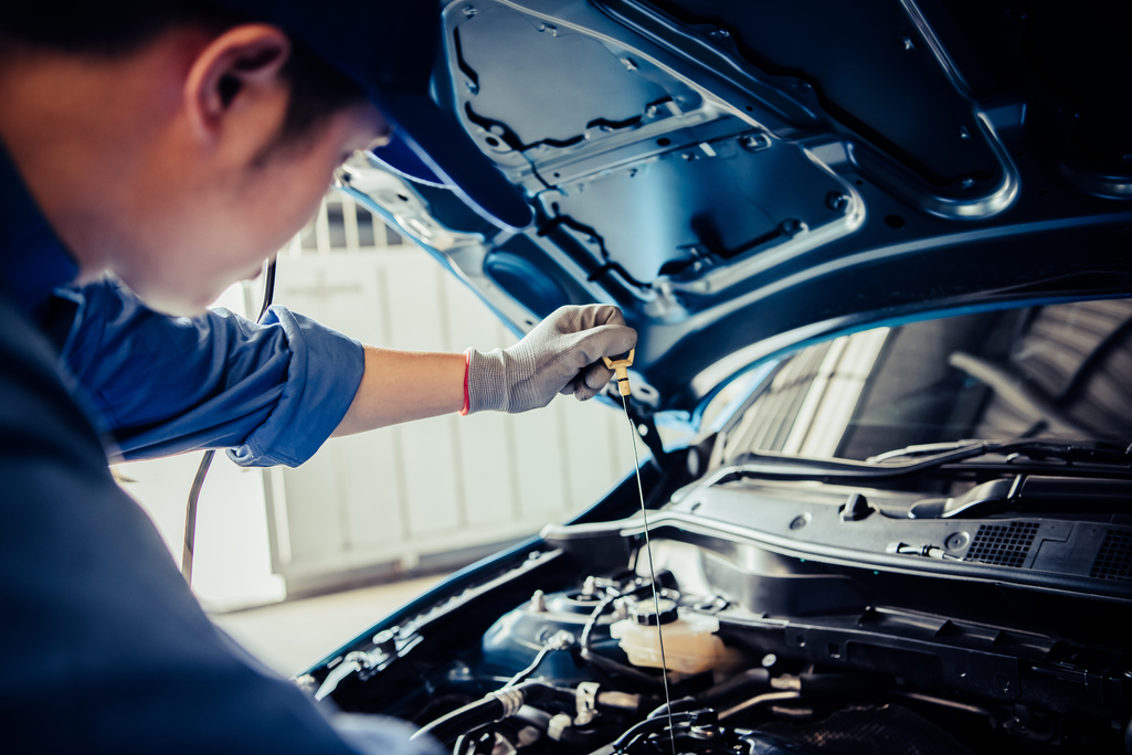 someone servicing a car